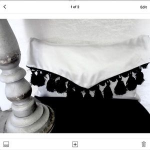 Pillow, envelope style with black tassel fringe. Black/white. Reversible